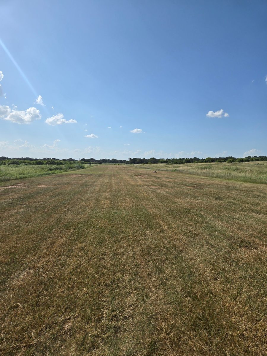 The runway at a Lockhart ranch after a pass, looking down the strip