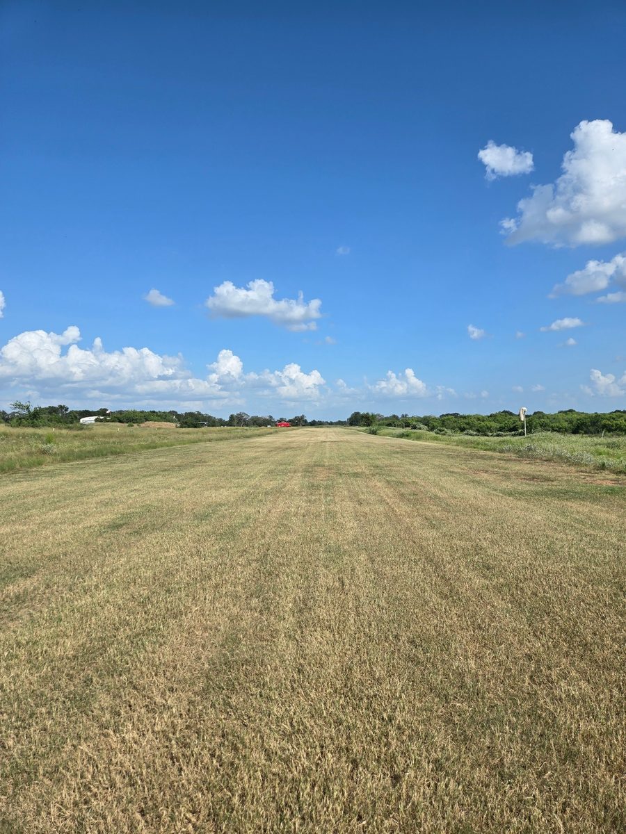 The same strip later in the day, mow lines running the full length